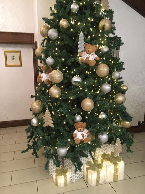 Victor Bear in Christmas tree at Southcrest Manor Hotel